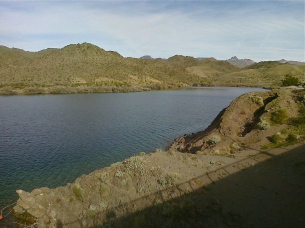 Lake mead, with dry hillsides and dark blue water