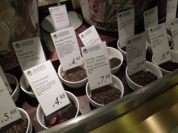 A counter with tea samples set out in dishes